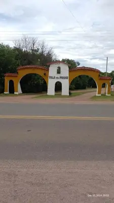 a building with a bridge on the side of a road at Dos Eucaliptus in Villa Rumipal