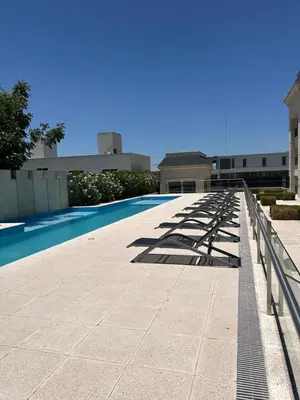 a row of shadows on the side of a building at Apart France - Charmant Suites in Río Cuarto