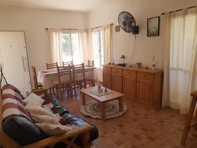 a living room with a couch and a table at Casa Emilia Tanti in Tanti