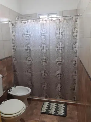 a bathroom with a shower with a toilet and a sink at Casa Emilia Tanti in Tanti