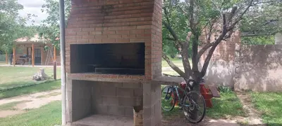 a brick oven with a bike parked next to it at La casa de Los Patitos in Arroyo de Los Patos