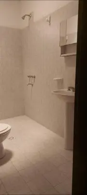 a bathroom with a toilet and a sink at La casa de Los Patitos in Arroyo de Los Patos