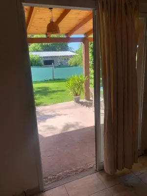 an open door with a view of a patio at El despertar Hospedaje in San Francisco del Monte de Oro