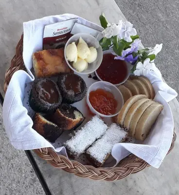 a basket of food with pastries and other foods at Tinkunaco Alta Gracia in Alta Gracia
