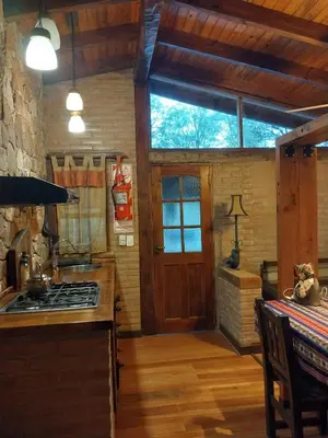 a kitchen with a stove top oven in a room at soy ahora in Pueblito