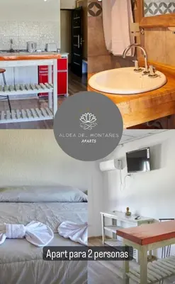 a room with a bed and a sink at Aparts Aldea Del Montañes in Mina Clavero