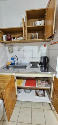 a small kitchen with a sink and a counter at Monoambiente Centro in Cordoba