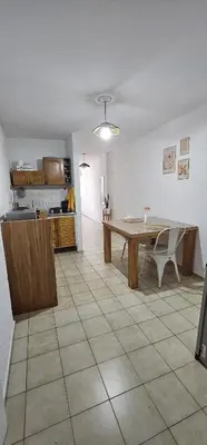 a kitchen and dining room with a table in a room at Monoambiente Centro in Cordoba