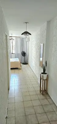 a room with a bed and a tiled floor at Monoambiente Centro in Cordoba