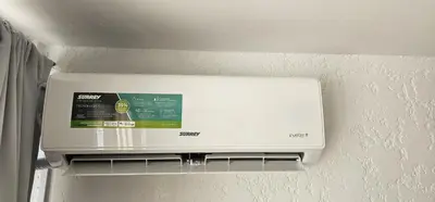 a white appliance is hanging on a wall at Monoambiente Centro in Cordoba