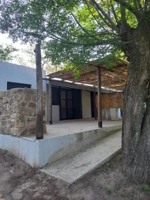 a house with a tree in front of it at Amaneceres de Cabalango in Cavalango