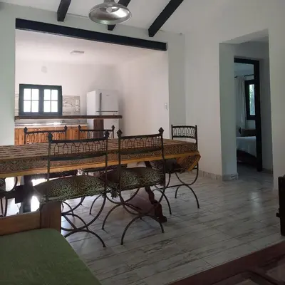a dining room with a table and some chairs at Amaneceres de Cabalango in Cavalango