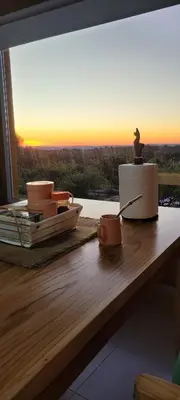 a table with a statue of a bird on top of it at Pedrolandia in Mina Clavero