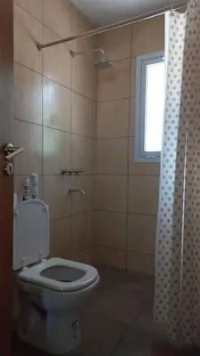 a bathroom with a toilet and a window at La casa del león in San Antonio de Arredondo