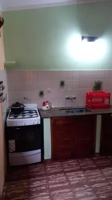 a kitchen with a stove and a sink at Abu Ma! in Tanti