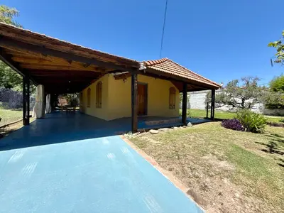 a house with a pavilion next to a swimming pool at Mina Clavero Chalet in Mina Clavero