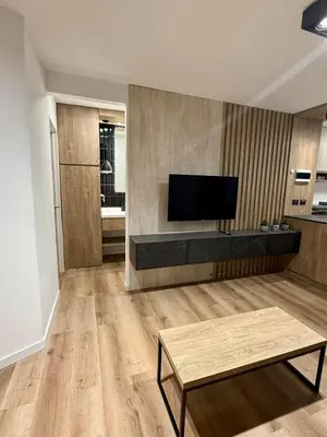 a living room with a flat screen tv on a wall at Departamento Confortable en Nueva Cordoba SS9 in Cordoba