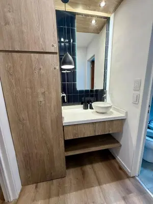 a bathroom with a sink and a mirror at Departamento Confortable en Nueva Cordoba SS9 in Cordoba