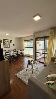 a living room with a couch and a table at Departamento en Guemes in Cordoba