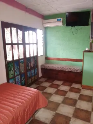 a bedroom with a bed and a tv on the wall at lodelrafa in San Lorenzo