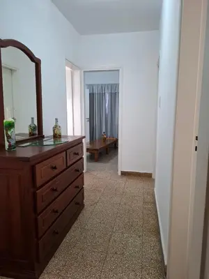 a bathroom with a wooden dresser and a mirror at Celestina 1 in Cordoba