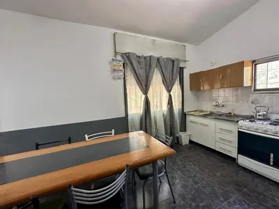 a kitchen with a table and chairs in it at La Casa De Juan in Mina Clavero