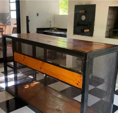 a bird cage with a wooden top in a room at Chalet Fratelli Rigoni in Villa Ciudad Parque