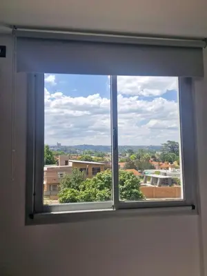 a window with a view of a city at DEPARTAMENTO Villa Carlos Paz altos de Lincoln in Villa Carlos Paz