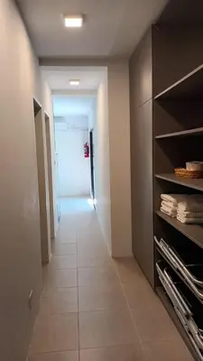a hallway of a room with a door and a hallwayngthngthngthngthngth at Las Lomitas in Carpintería
