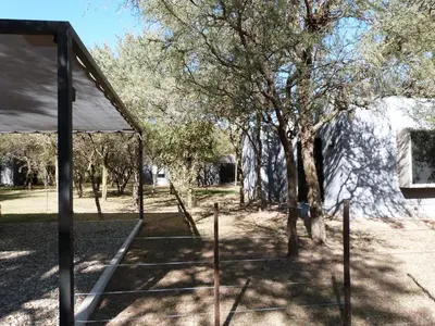 a tent and some trees and a building at Las Lomitas in Carpintería