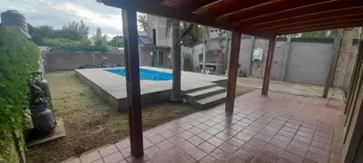 a view of a swimming pool in a backyard at Casa El Aromito Anisacate in Villa Anizacate
