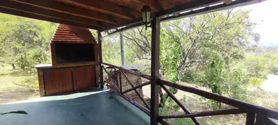 a view from the inside of a building with a window at Cabaña La Peulla in Cuesta Blanca