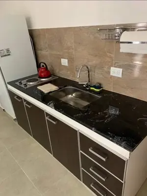 a kitchen with a sink and a counter top at El Jorgito in Villa Carlos Paz