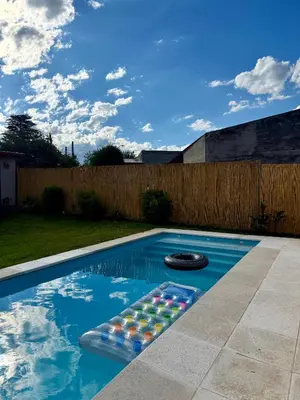 a swimming pool with a bunch of buoys in it at Casa con pileta a 2 cuadras del río in San Antonio de Arredondo