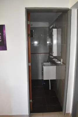 a bathroom with a sink and a mirror at Secret Garden in San Antonio de Arredondo
