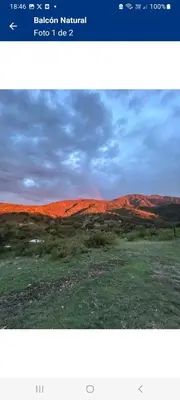 a screenshot of a picture of a desert with a rainbow at Balcón Natural in Los Hornillos