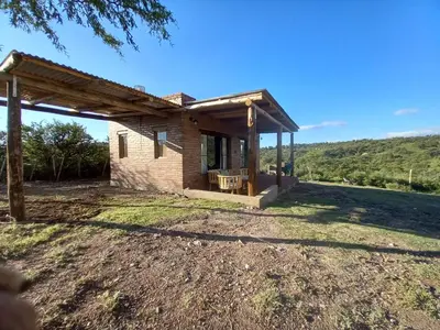 a small brick house with a roof at Balcón Natural in Los Hornillos