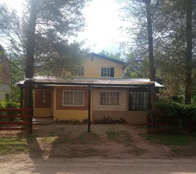 a house with a bunch of animals sitting in front of it at La Rinconada Nono in Nono