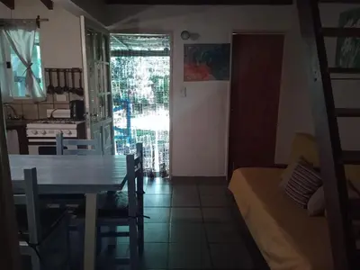a kitchen and dining room with a table and a dining room gmaxwell gmaxwell gmaxwell gmaxwell at La Rinconada Nono in Nono