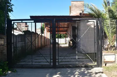 a cage with a lion inside of it at Oasis casa de descanso in Villa Carlos Paz