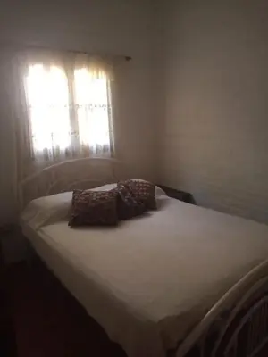 a bed with two pillows on it in a bedroom at CHE Camilo in Tanti