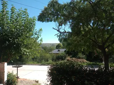 a view of a yard with trees and a house at CHE Camilo in Tanti