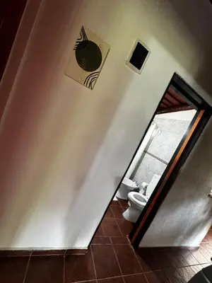 a bathroom with a staircase with a toilet in it at Amanecerenunsueñoyacanto in El Durazno