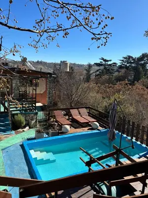 a swimming pool sitting on top of a house at La luisa segunda in Villa Parque Siquiman