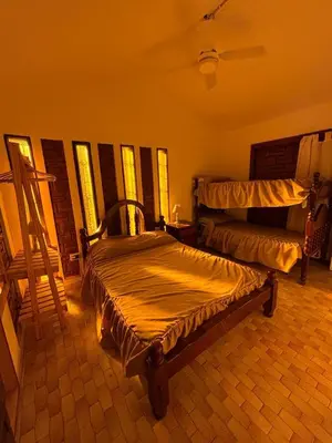 a bedroom with a large bed in a room at Complejo playa de oro 1 in Villa Carlos Paz
