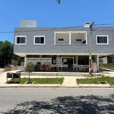 a building on the side of a street at Complejo playa de oro 1 in Villa Carlos Paz
