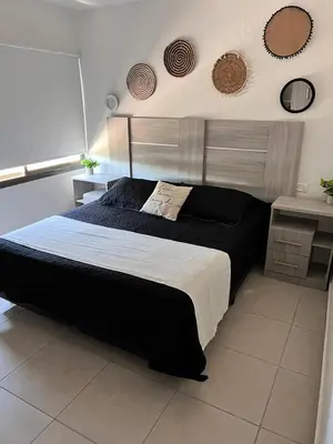 a bedroom with a large bed in a room at Terra Bella Hidromasajes in San Antonio de Arredondo