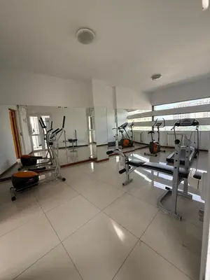 a gym with several tread machines in a room at Apart San Jose a 200mts de la peatonal in Villa Carlos Paz