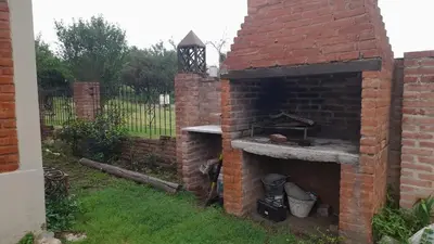 an outdoor brick oven in a yard at Cabaña petiza in Mina Clavero