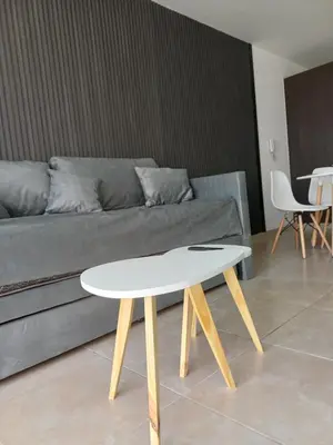 a coffee table in a living room with a couch at dto 22 TEMPO in Villa Carlos Paz
